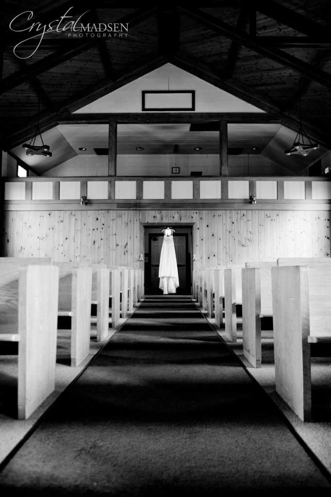 Wedding Dress Hanging In A Chapel